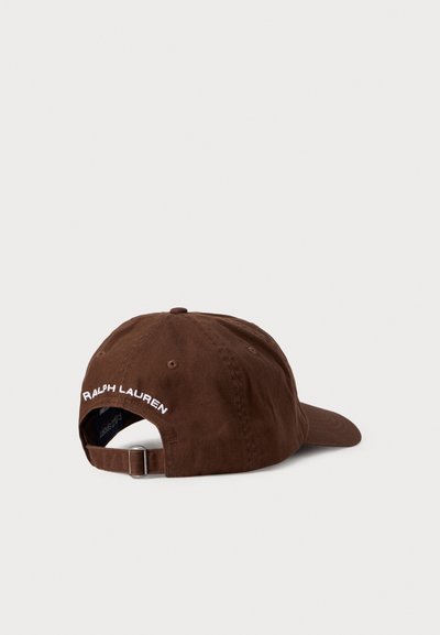 Brown adjustable baseball cap with "Ralph Lauren" embroidered in white above the back opening, displayed on a neutral background.