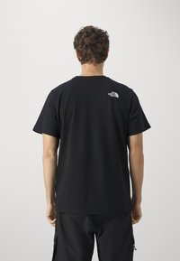 The North Face EASY TEE - Camiseta estampada - black
