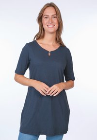Navy blue short-sleeve tunic top with scoop neckline and decorative keyhole detail. Features soft fabric and side pockets, relaxed fit.