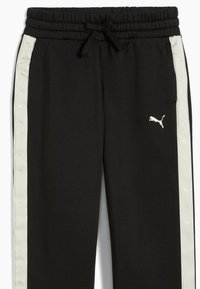 Pantaloni jogging neri sportivi con vita regolabile tramite cordino, dotati di pannelli laterali grigio chiaro ornati da piccoli loghi ripetuti e texture liscia.