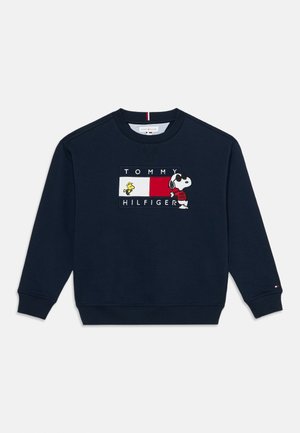 Mørkeblå sweatshirt med Tommy Hilfiger-logo, med Snoopy iført solbriller og en rød skjorte, samt Woodstock på fronten.