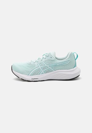 Light blue athletic shoe with a breathable mesh upper, white midsole, and black rubber outsole; features lace-up closure and reflective accents.