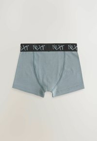 Männer-Boxershorts aus einem gedeckten blauen Stoff mit einem schwarzen elastischen Bund, der das graue "Next"-Logo trägt. Glatte Textur mit einem taillierten Design.