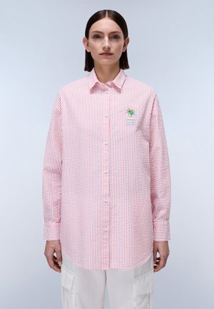 Red and white striped button-up shirt with a classic collar and long sleeves. Features a small embroidered palm tree logo on the chest.