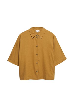 Senfgelbes kurzärmeliges Hemd mit Kragen, schwarzen Knöpfen und lockerem, kastigem Schnitt.