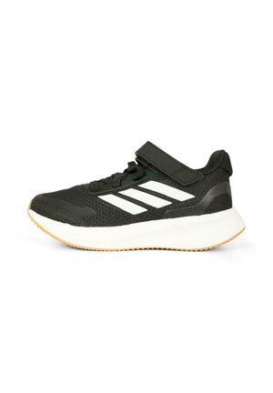 Scarpe da ginnastica nere con tomaia in rete, accenti a strisce bianche, cinturino regolabile e suola in gomma testurizzata. Design leggero per il massimo comfort.