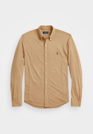 Long-sleeve khaki shirt in soft fabric, featuring a button-down collar, front buttons, and an embroidered logo on the left chest.