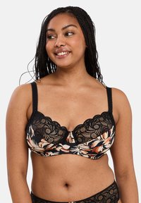 Reggiseno in pizzo nero con motivi floreali in tonalità di arancio e crema, con un design scallop, supporto con ferretto e un fiocco decorativo al centro.