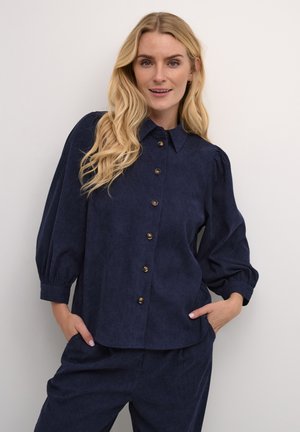 Marineblauwe, knoopsluiting shirt met kraag, opgeblazen mouwen en gouden knopen. Glad stof met een licht gestructureerde afwerking.
