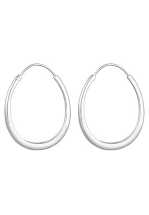 Sølvøreringe med en glat, poleret overflade. Deres cirkulære form har et sømløst design og en minimalistisk æstetik.