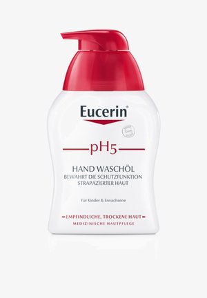 Eucerin pH5 hand wash oil in a white plastic pump bottle with a red lid. Features a label with clear text and logo, designed for sensitive skin.