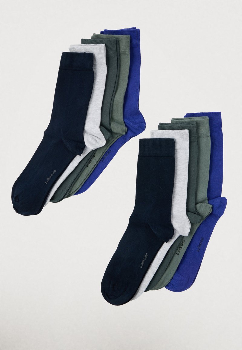 Ensemble de dix paires de chaussettes de différentes couleurs : marine, gris, vert et bleu. Présente une texture lisse et des bords côtelés.