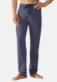 Marine loungebroeken met een geometrisch patroon in wit en rood. Gemaakt van zachte stof met een elastische tailleband en verstelbaar trekkoord.