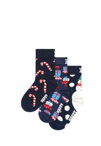 Paczka trzech skarpetek z kolorowymi wzorami: jedna z laskami cukrowymi, druga z prezentami, a trzecia w kropki i z bałwankiem.