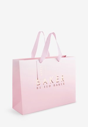 Light pink shopping bag with pink fabric handles and gold embossed text reading "BAKER BY TED BAKER" on the front.