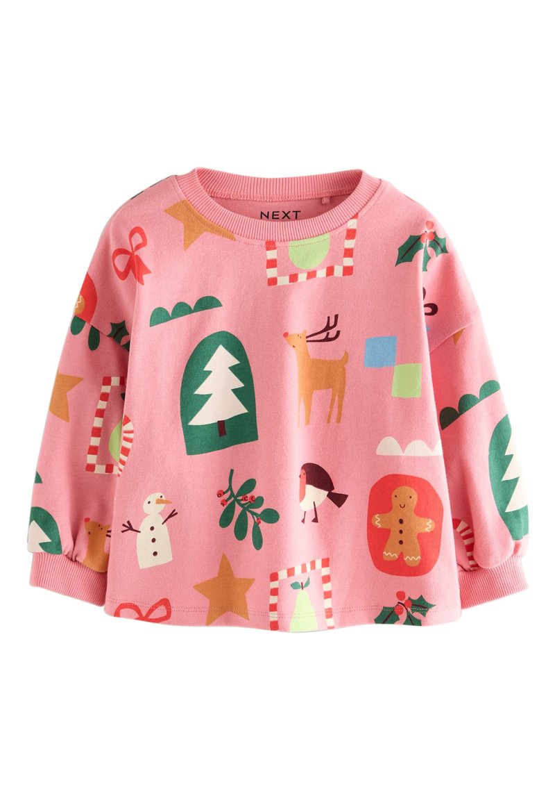 Roza majica z dolgimi rokavi z različnimi prazničnimi vzorci: jeleni, snežak, drevo in zvezde v zeleni, rdeči in beli barvi.