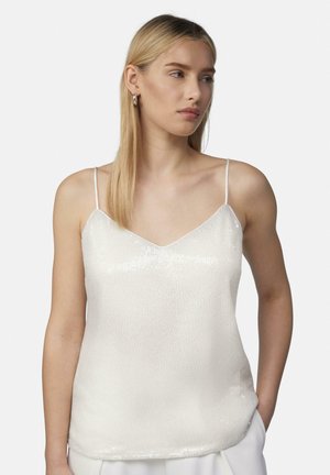White sequin camisole with thin spaghetti straps and a V-neck design, featuring a textured surface and a relaxed fit.
