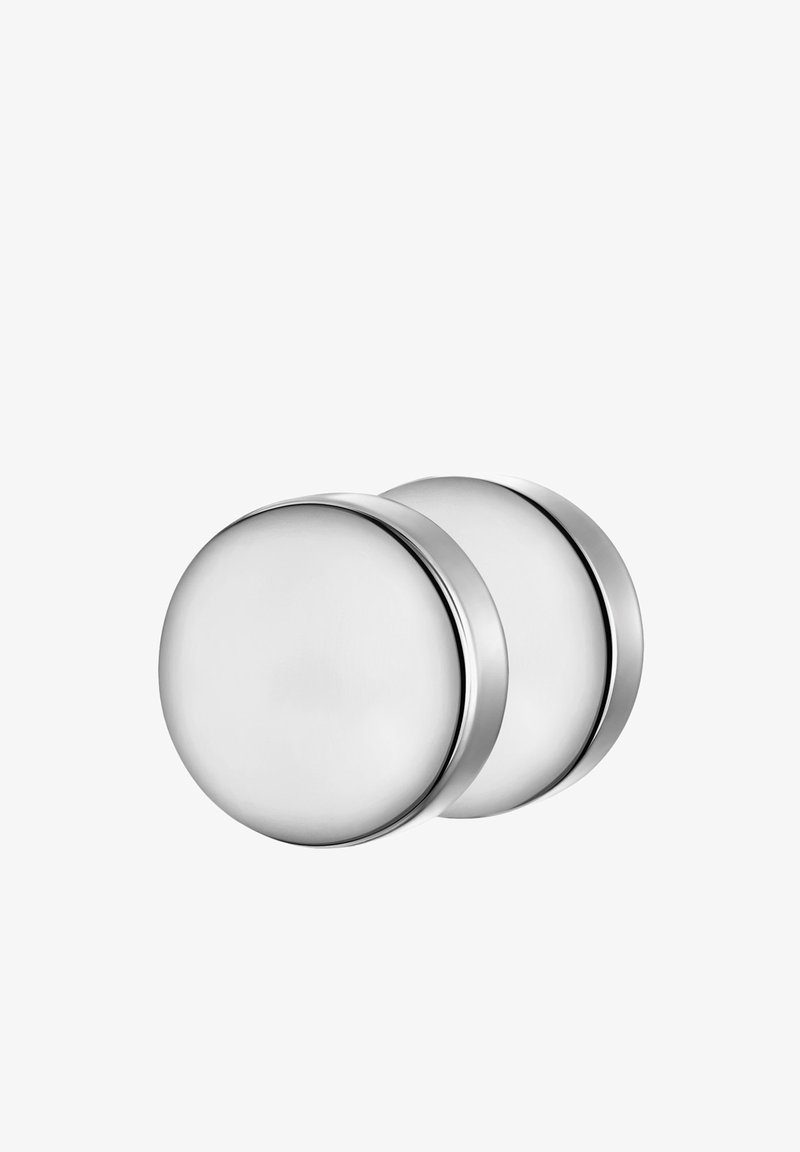 Runde kabinetknopper i rustfrit stål med børstet finish, der har en glat overflade og diskret kantdetalje, monteret i par.