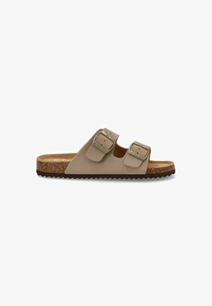 Sandalia deslizante de cuero beige que presenta dos hebillas ajustables, una plantilla de corcho y una suela de goma texturizada con un ligero diseño en cuña.