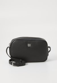 Black soft leather crossbody bag with a zip closure, silver logo, adjustable strap, and rectangular shape. Textured surface detail.