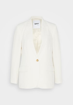 Hvit blazer med en enkelt gylden knapp, skarpe slag, to frontlommer og satinfôr. Enkel, skreddersydd design.