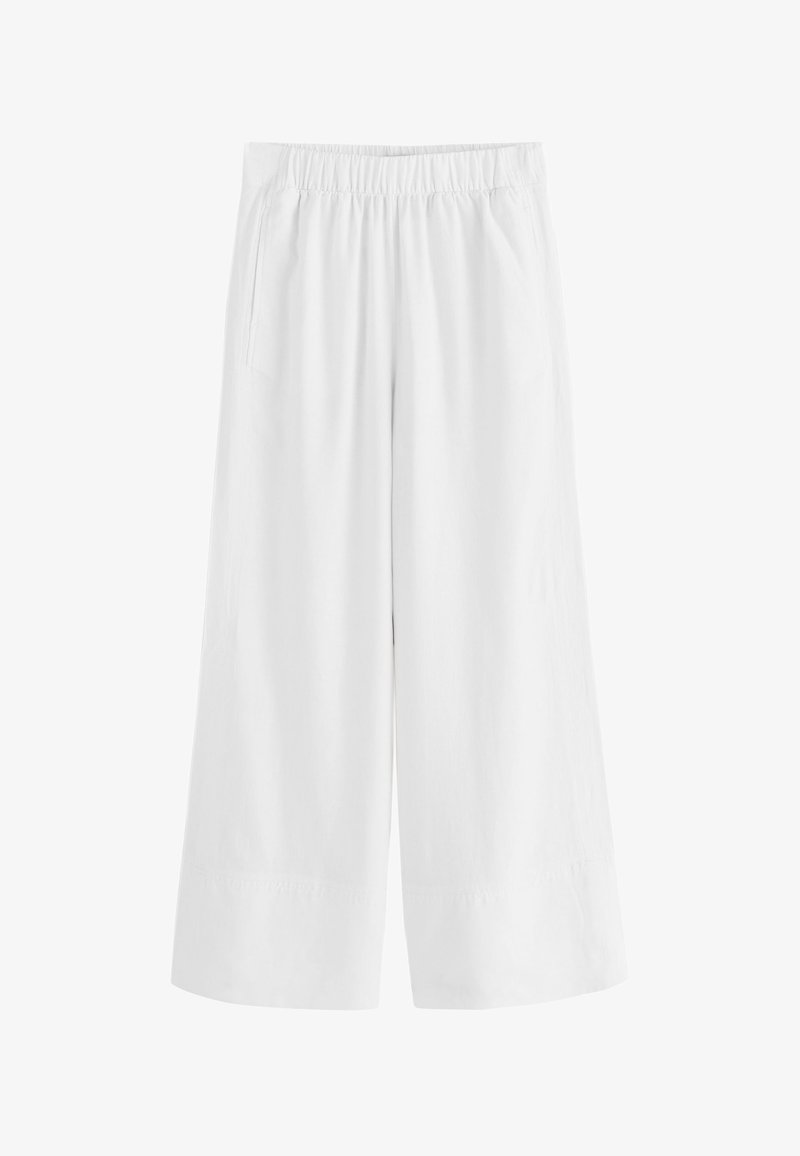 Pantalon blanc à jambes larges avec taille élastique et poches latérales, conçu pour une coupe ample et confortable.