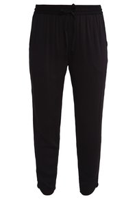 Černé joggingové kalhoty vyrobené z měkké tkaniny, s elastickým pasem a šňůrkou, zúženými nohavicemi a bez viditelných vzorů nebo akcentů.