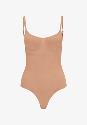 Nude bodysuit with thin straps, ribbed texture, and a fitted shape. Features a low back and subtle branding on the side.