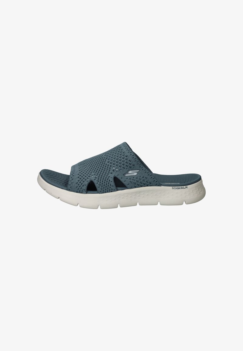 Blue mesh slide sandal with slip-on design, featuring open toe and side cutouts. Lightweight white sole with textured tread pattern.