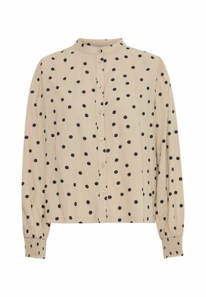 Beige garš sleeves blūze ar melniem punktiņiem, pogu priekšpuse, stāvošā apkakle un elastīgas aproces. Mīksta auduma ar gludu tekstūru.