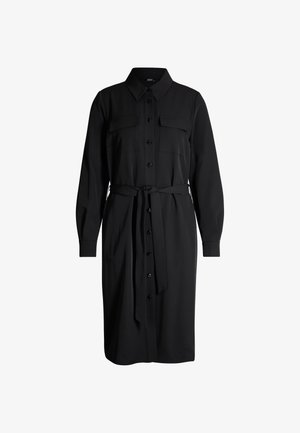 Abito camicia nero con chiusura a bottoni, due tasche sul petto, maniche lunghe, colletto e cintura in vita. Tessuto dalla trama liscia.