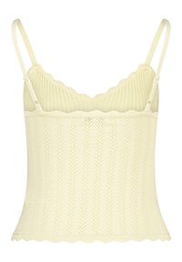 Knitted camisole in pale yellow with thin adjustable straps, scalloped edges, and a textured vertical rib pattern.