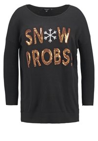 Černý svetr s dlouhými rukávy, vyznačující se flitrovým nápisem "SNOW PROBS" a designem sněhové vločky. Měkká látka s volným střihem.