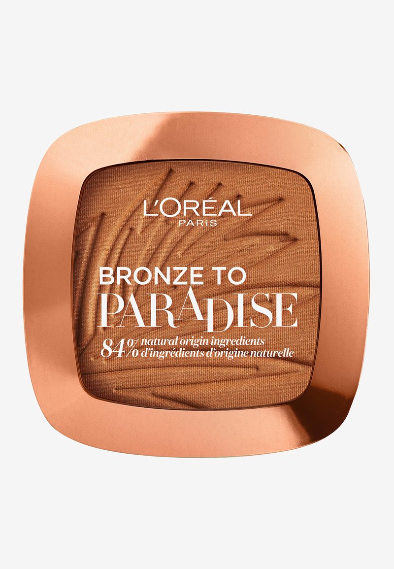 Compact de bronzer avec un boîtier couleur cuivre, présentant une poudre bronzante texturée et un texte blanc indiquant "L’Oréal PARIS BRONZE TO PARADISE."