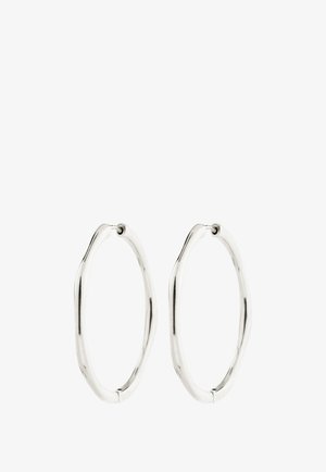 Pair of silver-tone oval hoop earrings with a slightly irregular, wavy shape and hinge clasps on a white background.