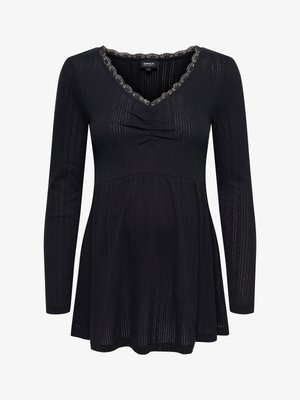 Top negro de manga larga con escote en V, con detalles de pliegues en el busto, textura acanalada fina y escote de encaje con borde en forma de concha.