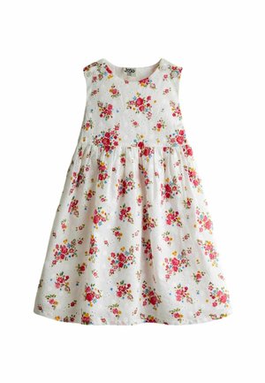 Witte mouwloze meisjesjurk met roze, rode, gele en blauwe bloemenprint en knopen op de schouderbandjes.