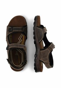 Braune Sandalen mit doppelt verstellbaren Riemen, strukturiertem Leder, einem gepolsterten Fußbett und einer strapazierfähigen Gummisohle mit Profil.