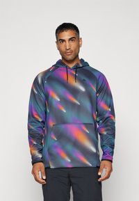 Felpa con cappuccio in un motivo multicolore di blu, viola, arancione e teal. Presenta una tasca frontale e un cappuccio regolabile. Realizzata in un tessuto morbido.