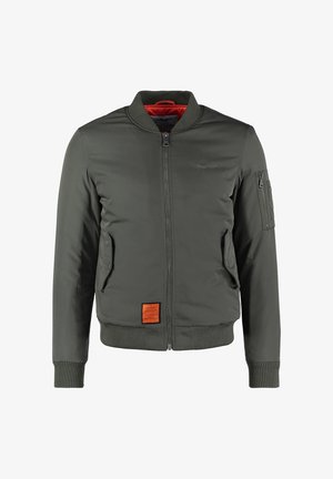 Giacca bomber verde oliva con zip frontale, due tasche laterali con patta, polsini e orlo a coste e una piccola tasca con zip sulla manica sinistra.
