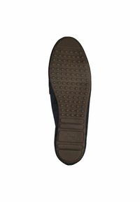 Schuhsohle aus braunem Gummi mit einem strukturierten Muster aus kleinen Punkten und Rillen, designed für Grip und Komfort.