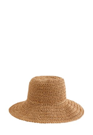 Chapeau de soleil en paille tressée marron avec un large bord souple, conçu pour protéger du soleil et pour un port décontracté.