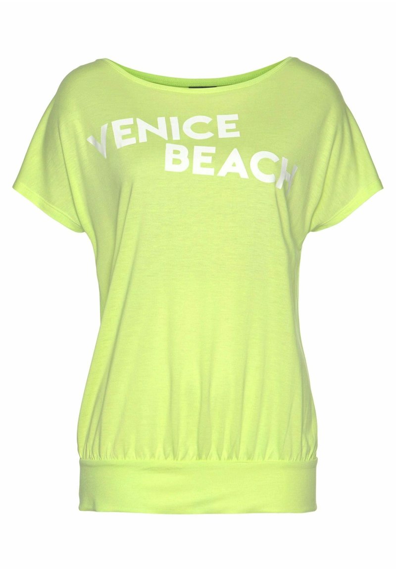 Světle zelený krátký rukáv top s volným střihem, který má na přední straně tučná bílá písmena "VENICE BEACH" a nařasený lem.