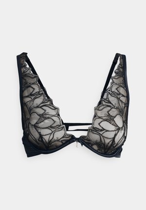 Black bra featuring sheer mesh panels with floral embroidery and embellishments, plunging neckline, and adjustable straps.