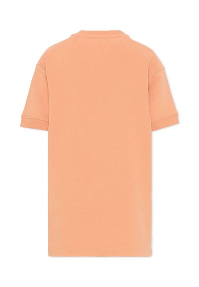 T-shirt uni couleur pêche à manches courtes, présenté de dos, avec des poignets côtelés et un col rond.