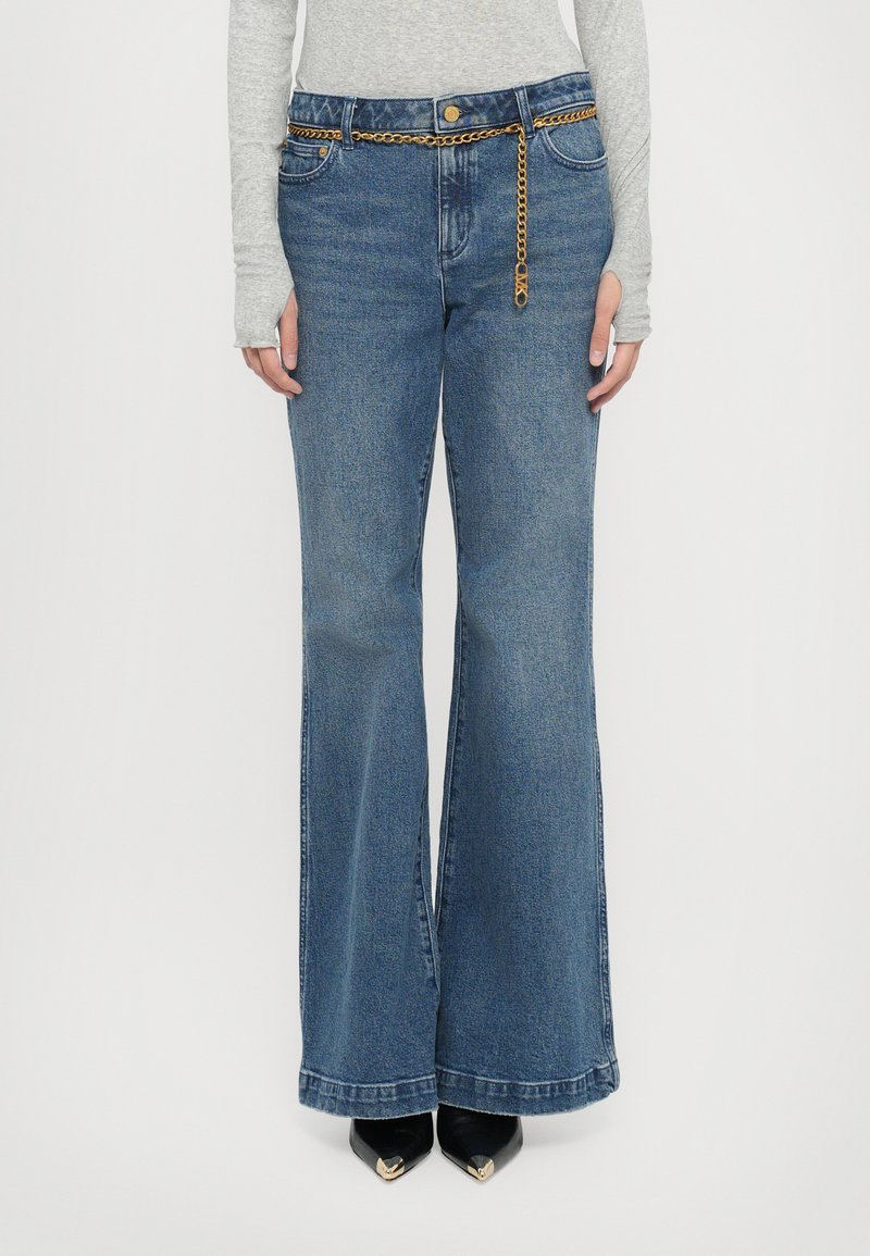 Flared blue denim jeans with a chain detail at the waist and front pockets, featuring a classic five-pocket design and a solid finish.