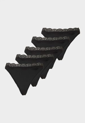 Piecas melnas sieviešu bikini tipa apakšbikses ar mežģīņu jostas detaļām, izvietotas pakāpeniski vienkrāsainā fonā.