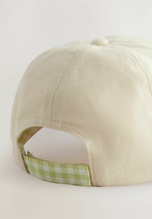 Beige cap with a textured cotton fabric. Features a green gingham patterned underband and a central fabric button on top.