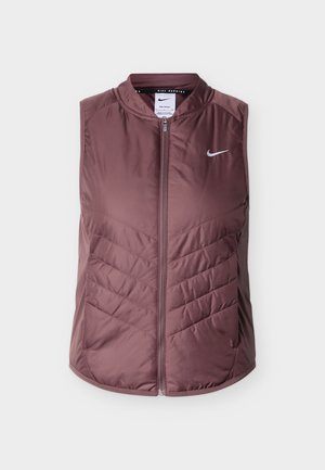 Veinipunane Nike vest esiküljel lukuga, ümar kaelus ja esiküljel chevron-kootud muster; kerge materjal, ilma varrukateta.