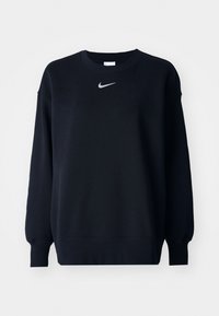 Schwarzer Nike Sweatshirt mit langen Ärmeln, gerippten Bündchen und Saum. Auf der Brust befindet sich ein kleines weißes Nike-Swoosh-Logo.